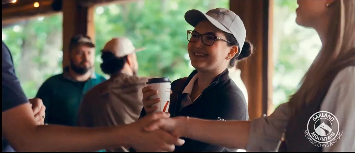 Guests smiling and greeting one another at Garland Mountain