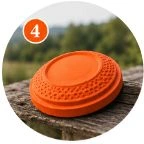Orange clay on a wooden surface